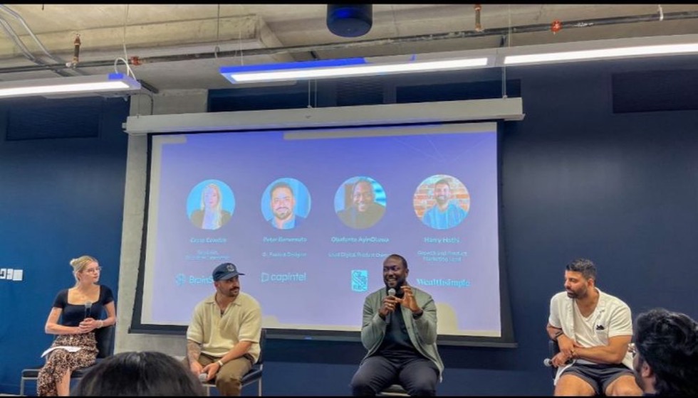 Funto speaking on a product panel, mic in hand